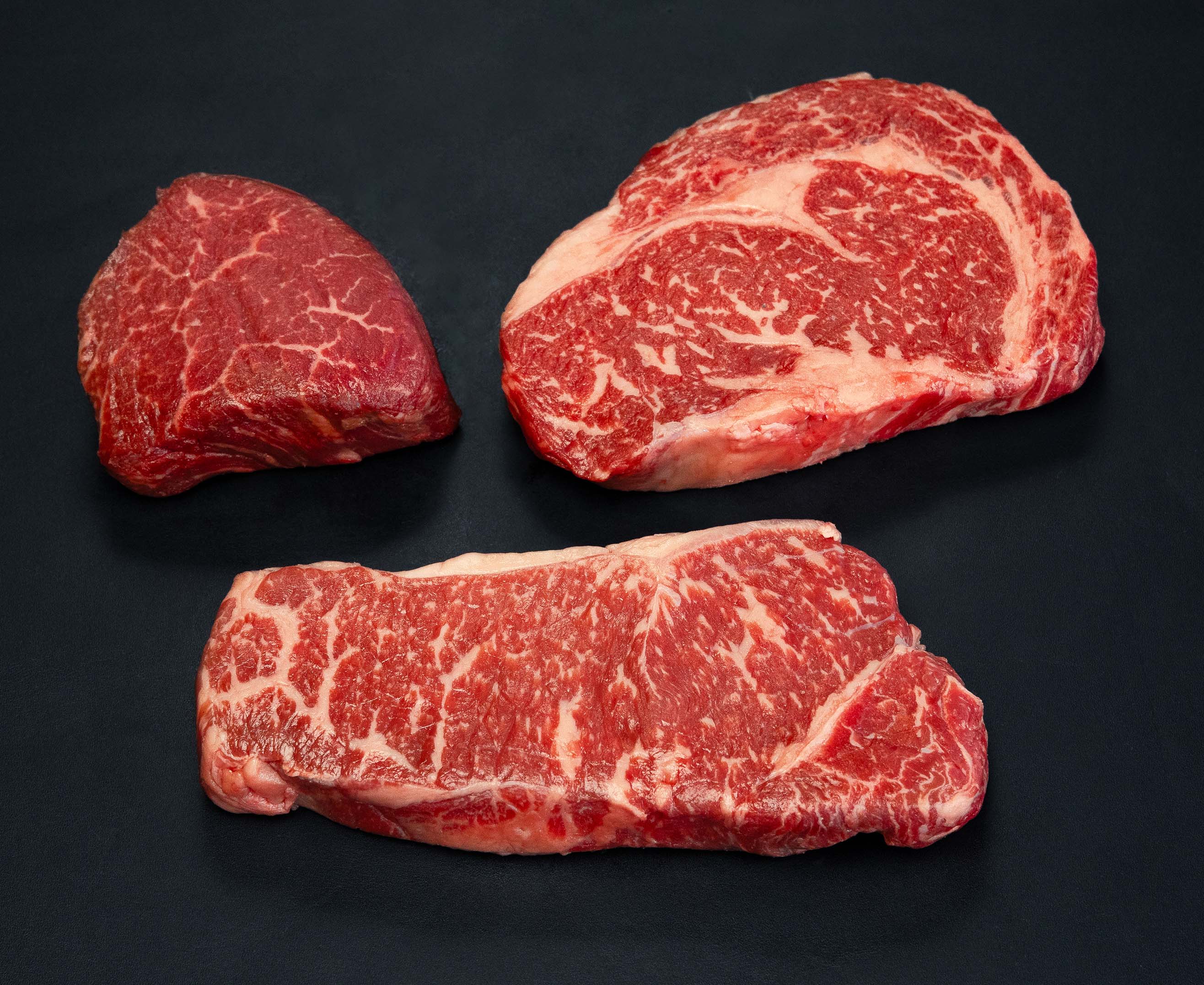 Premium beef cuts including ribeye steaks